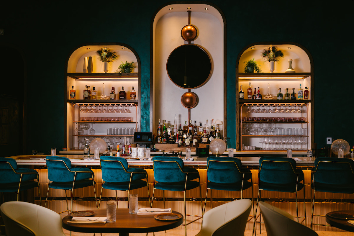Late August’s jewel-toned dining room at the Ion, where the Michelin-recommended restaurant is ending regular dining service and shifting its focus to private events and catering. | Photo by Rebekah Flores