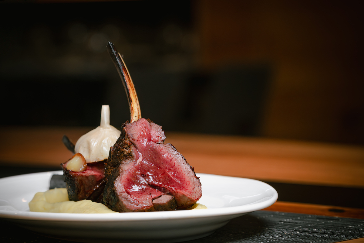 A beautifully plated elk rack showcases the bold, refined approach to steakhouse dining at Chr Steak in Gainesville, Georgia. | Photo by Southern Exposure Media Group