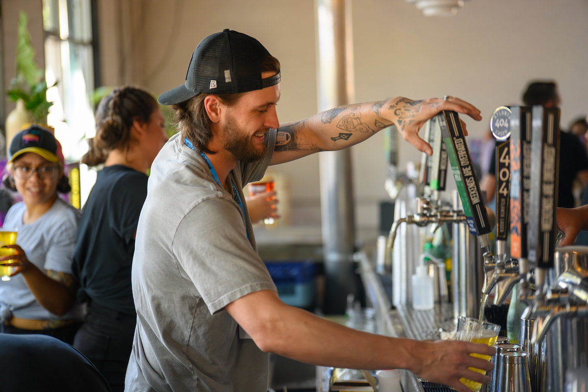 Gluten Freedom Festival ATL - DiningOut A bartender pours a draft beer at the Gluten Freedom Festival ATL at Monday Night Brewing. | Photo by Monday Night Brewing