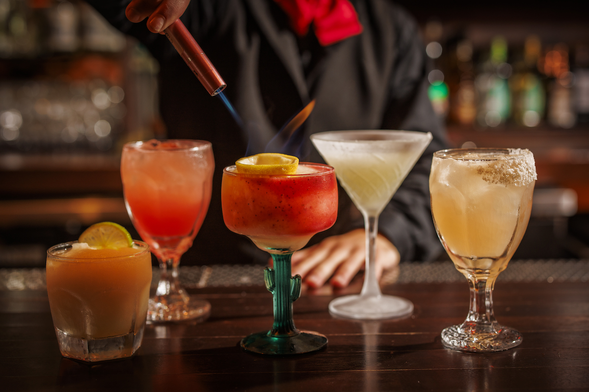 El Molino - DiningOut El Molino's signature Flaming Margarita joins handcrafted cocktails, frozen margaritas and rare sipping tequilas on the restaurant's beverage menu. | Photo by Samantha Marie Photography