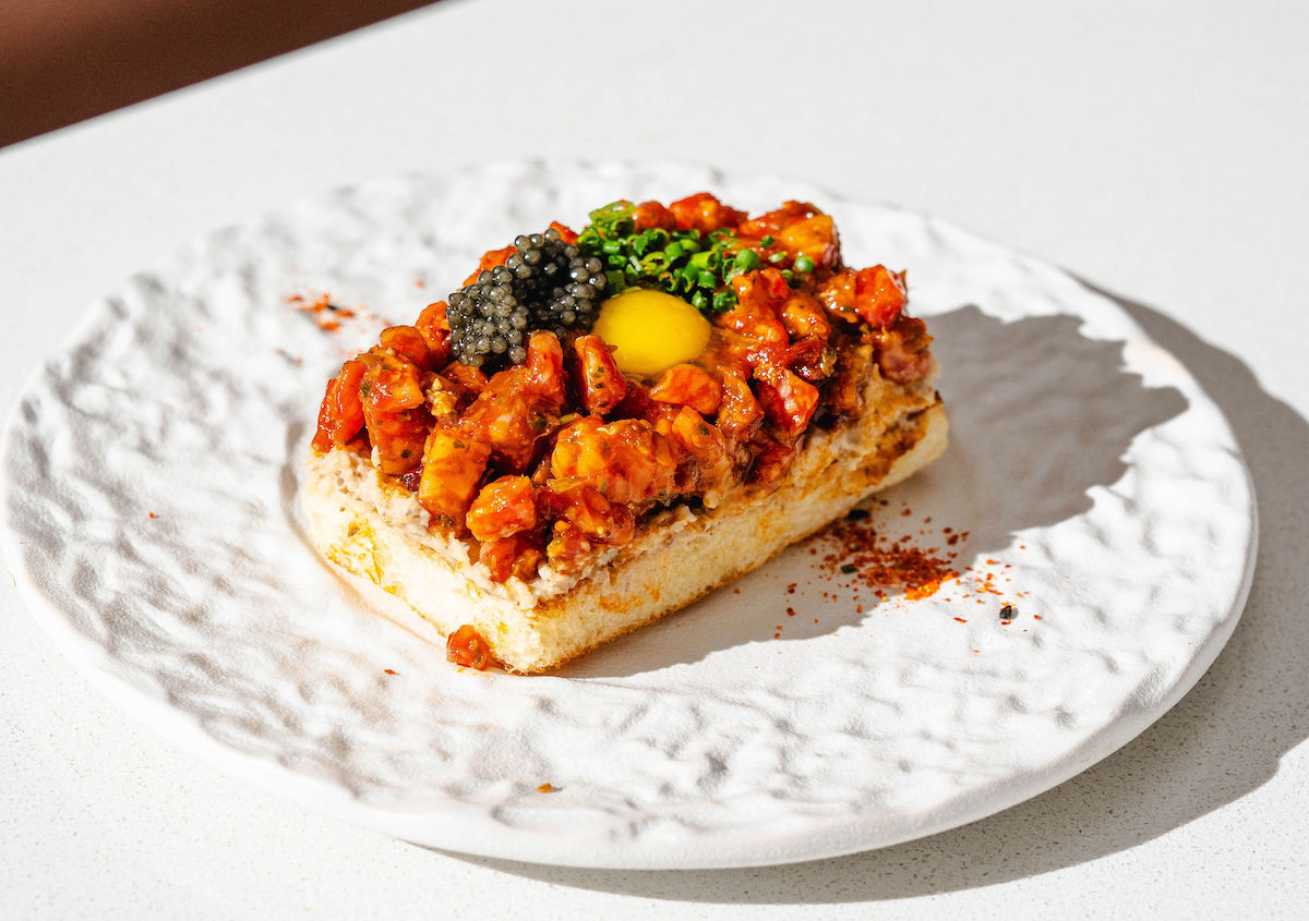 A5 Wagyu toast gets an indulgent finish with caviar and egg yolk at Doko. | Photo by Studio Rivera
