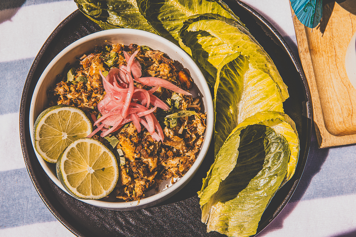 Aguasal’s mojo pork belly lettuce wraps pair tender pork with crisp lettuce and Jamaican slaw. | Photo by Samantha Marie