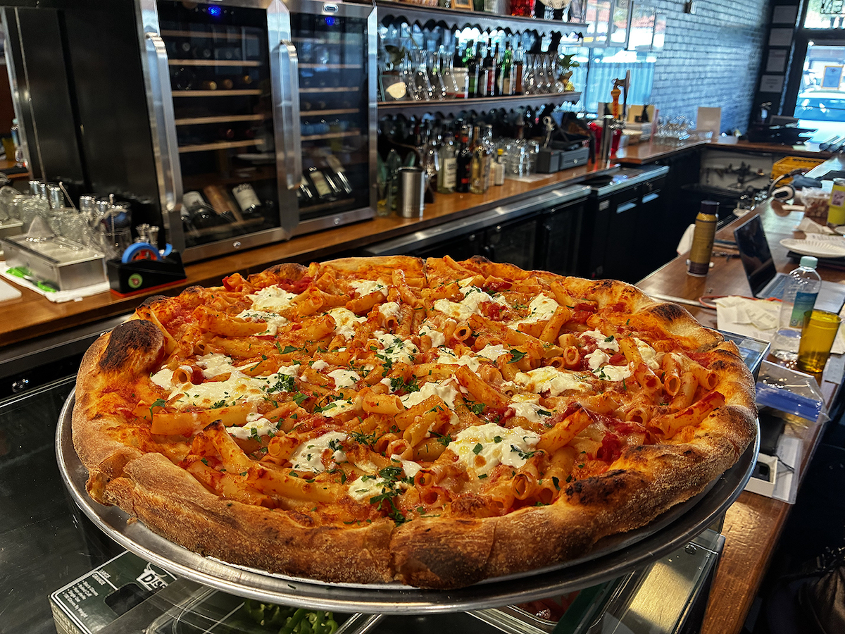 Salisbury’s serves 18-inch New York-style pies, including a loaded baked ziti pizza inspired by co-owner Will Salisbury’s childhood. | Photo by Salisbury’s Pizza