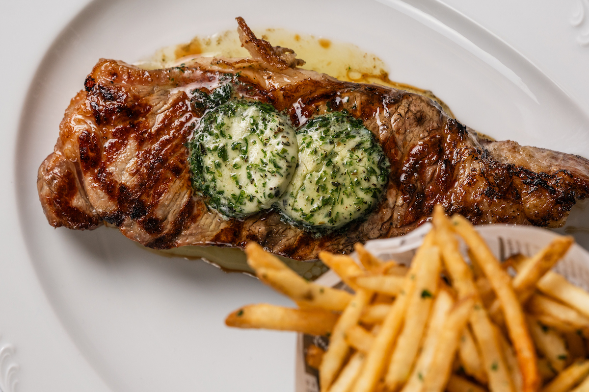Annabelle Brasserie serves its Parisienne steak frites with New York strip, garlic-herb butter and crisp pommes frites. | Photo by Brian Kennedy