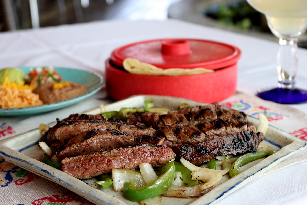 Sizzling beef fajitas at Sylvia's Enchilada Kitchen. | Photo by Sylvia's Enchilada Kitchen
