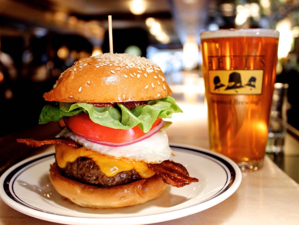 Buckhead Diner’s towering burger, served with bacon, cheese, a fried egg, and all the fixings, was part of the appeal at the beloved Atlanta institution. | Photo by Buckhead Diner