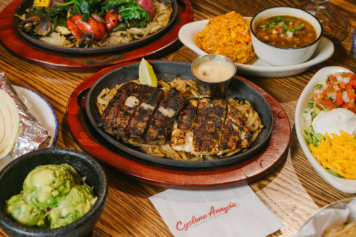 A full fajita spread at Cyclone Anaya’s, where sizzling beef, chicken, and veggie platters come with all the classic Tex-Mex fixings. | Photo by Rebekah Flores