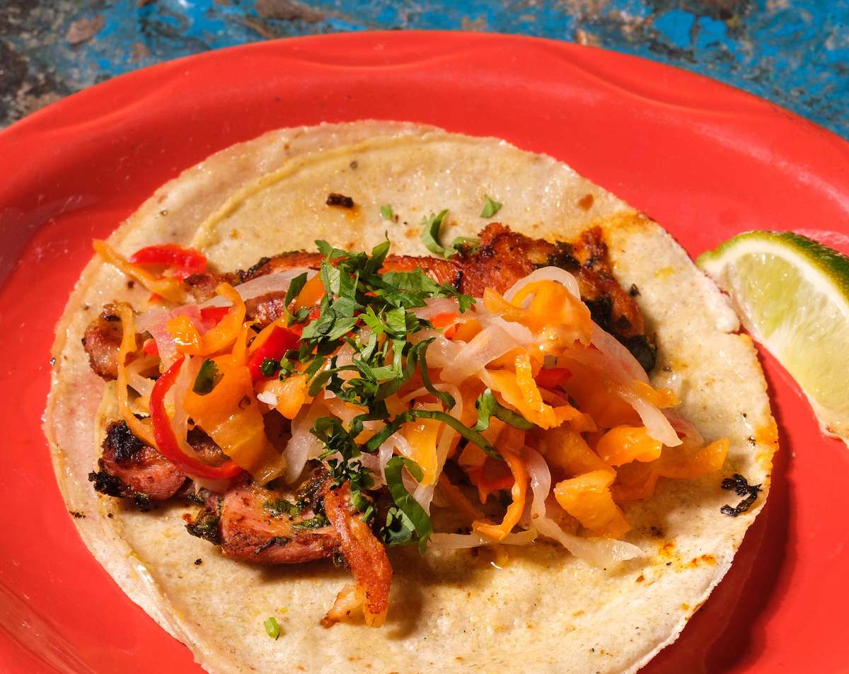 The Chile Picante taco at Bone Garden Cantina turns up the heat with dark meat chicken, habanero salsa, fresh cilantro and a lime on the side. | Photo by Bone Garden Cantina