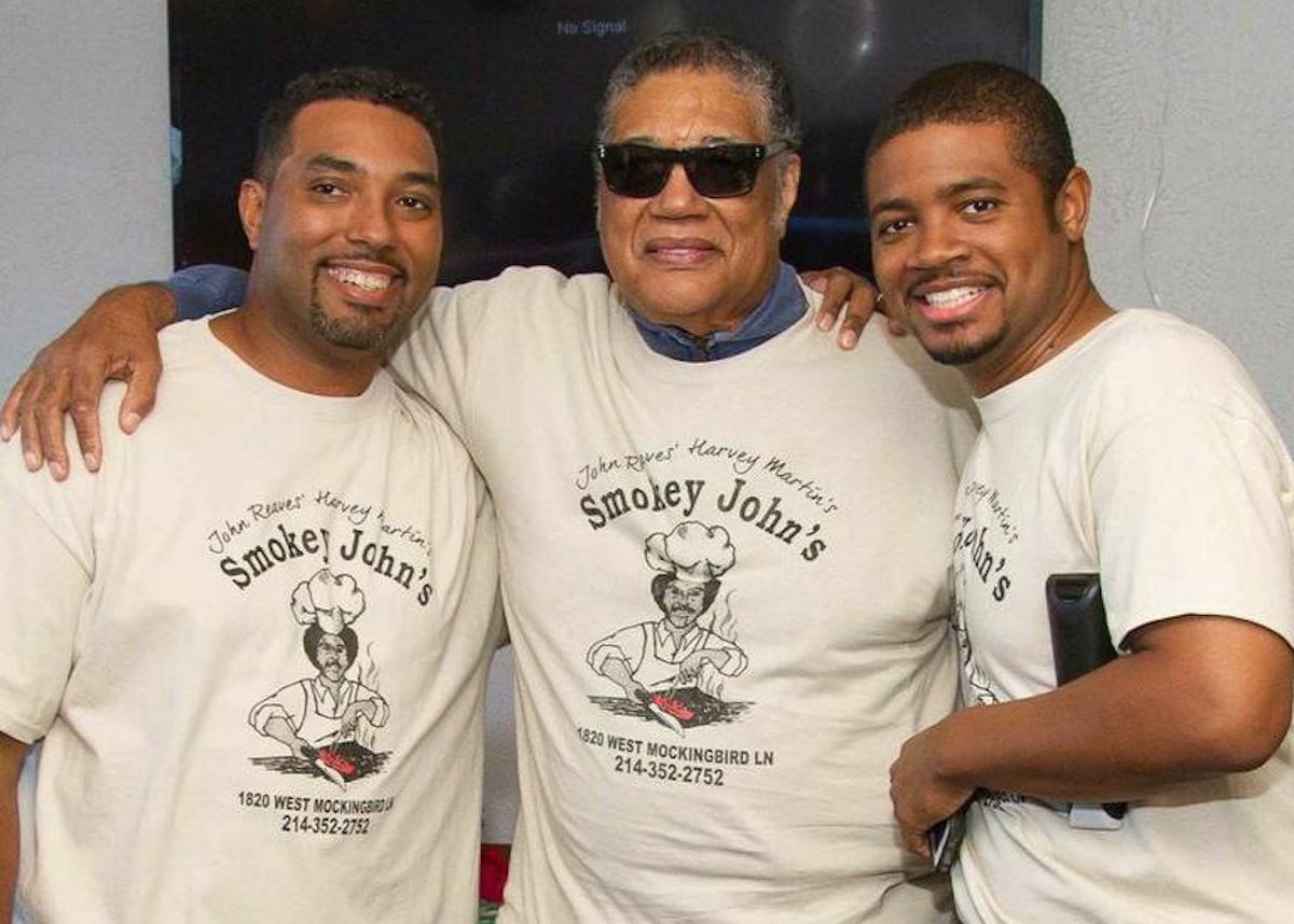 Smokey John’s founder “Smokey” John Reaves, center, with sons Juan and Brent Reaves, who now carry on their father’s legacy as co-owners of the restaurant. | Photo by Smokey John's BBQ