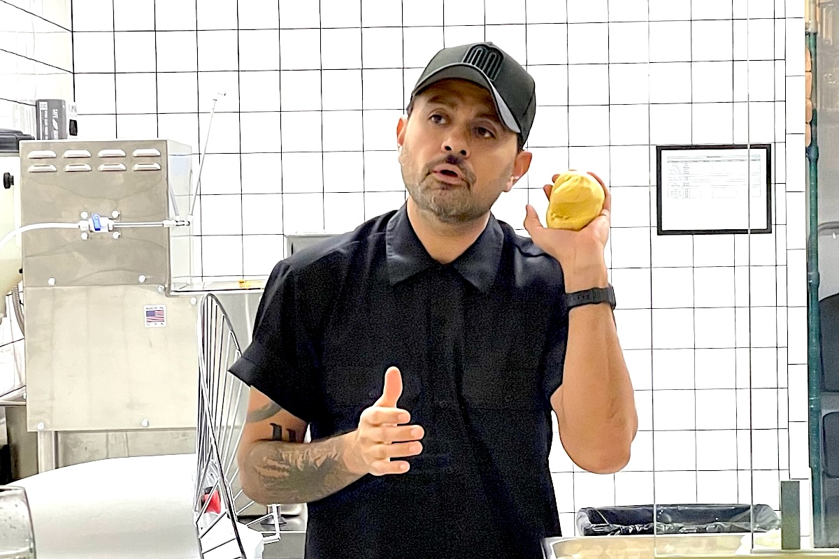 DEN_Molino_Chido_chef-Michael_by_Ruth_Tobias - DiningOut Chef Michael Diaz de Leon showing off a ball of masa in his moline. | Photo by Ruth Tobias