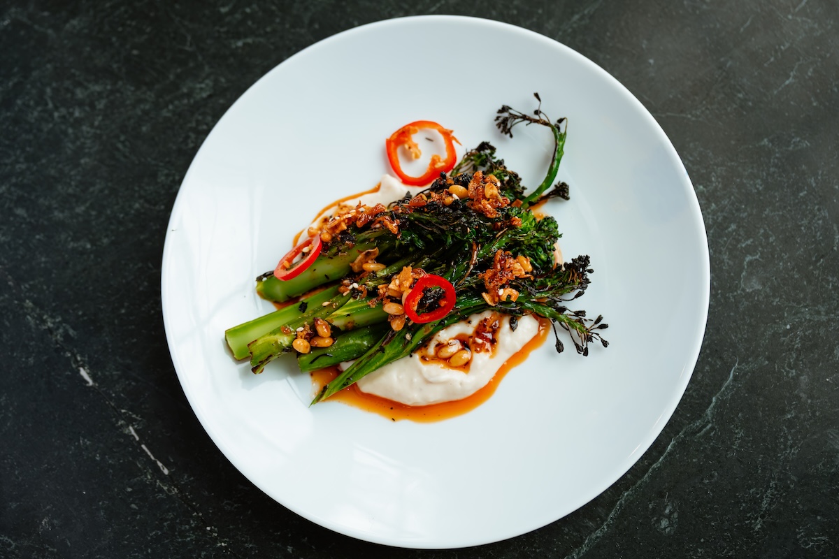 Vegetables are the star at Soda Club, like this plate of broccolini. | Photo by Lucy Beaugard