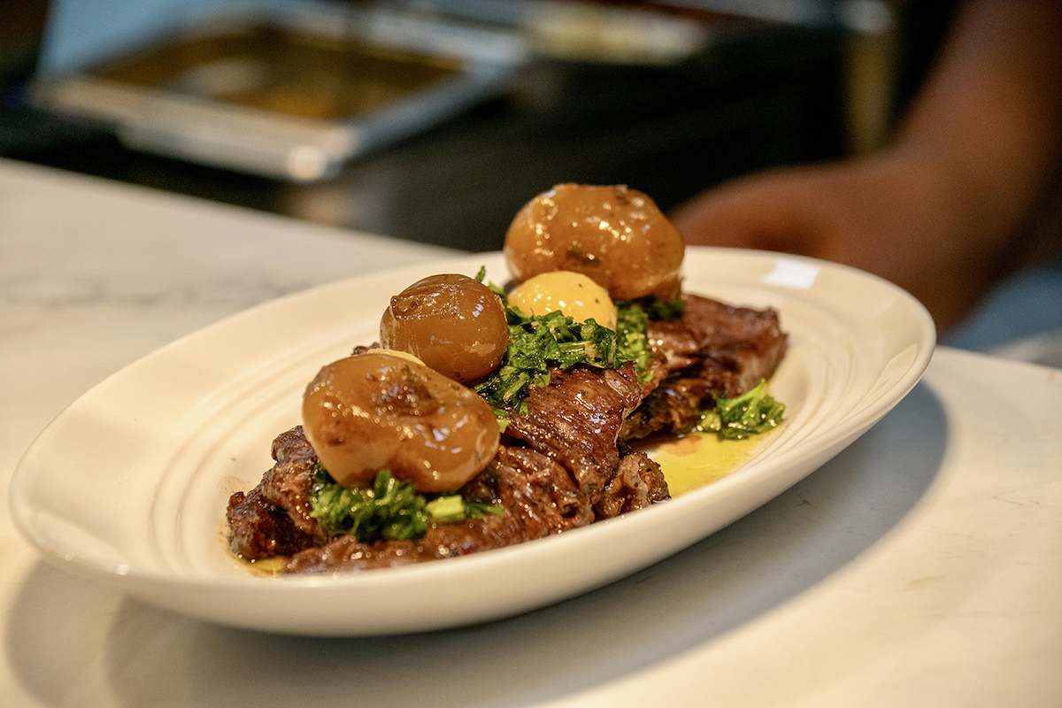 Wagyu Denver steak showcases the wood-fired cooking at chef Tiffany Derry and Tom Foley’s Radici. | Photo by Mia Valdez