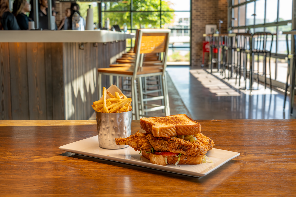 The Landing’s buttermilk-fried pork chop sandwich is a nod to chef Tiffany Derry’s hometown of Beaumont, Texas. | Photo by The Landing