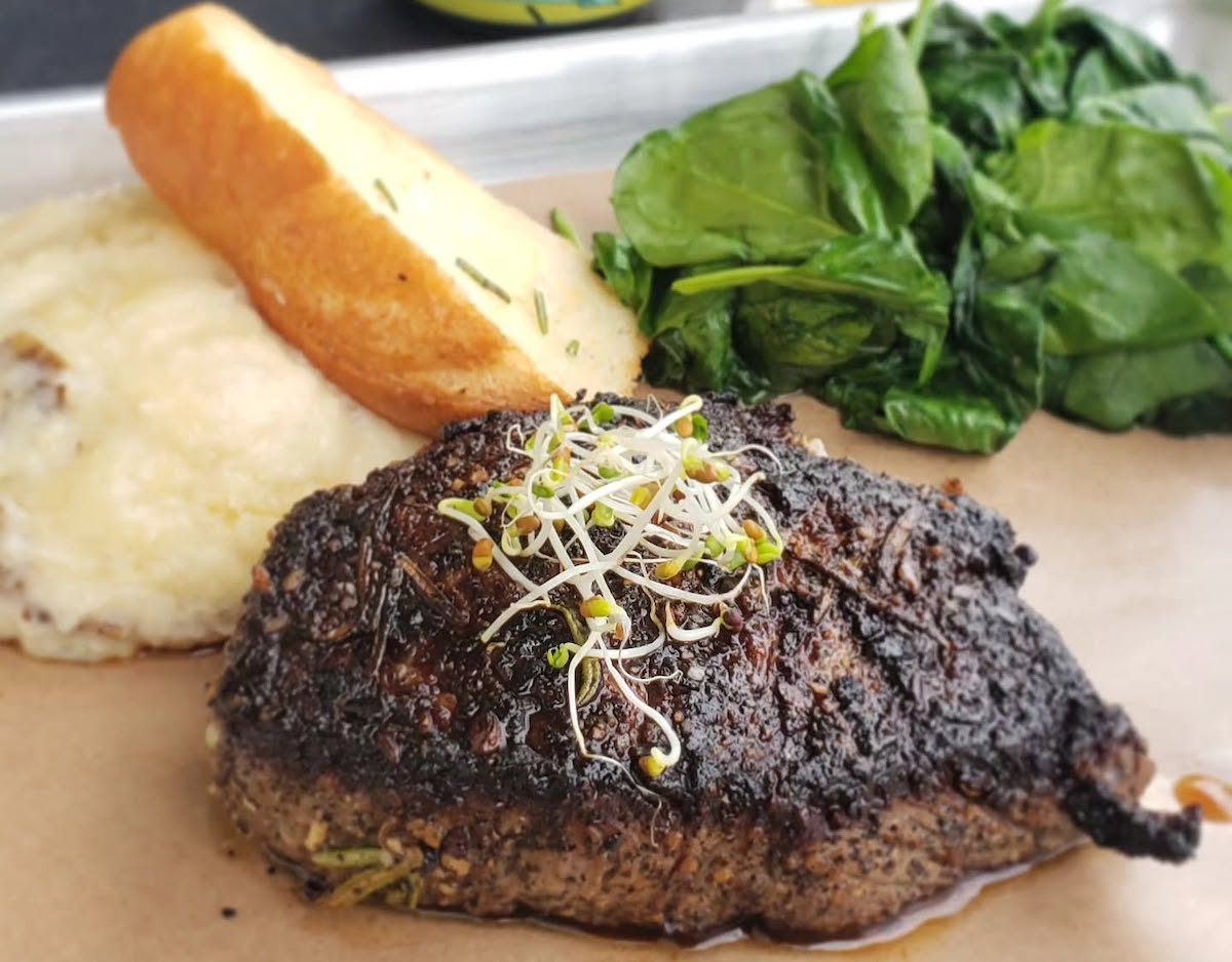 Henderson & Kane’s Monday steak night features 44 Farms beef with garlic mashed potatoes, sautéed spinach, and toast. | Photo by Henderson & Kane