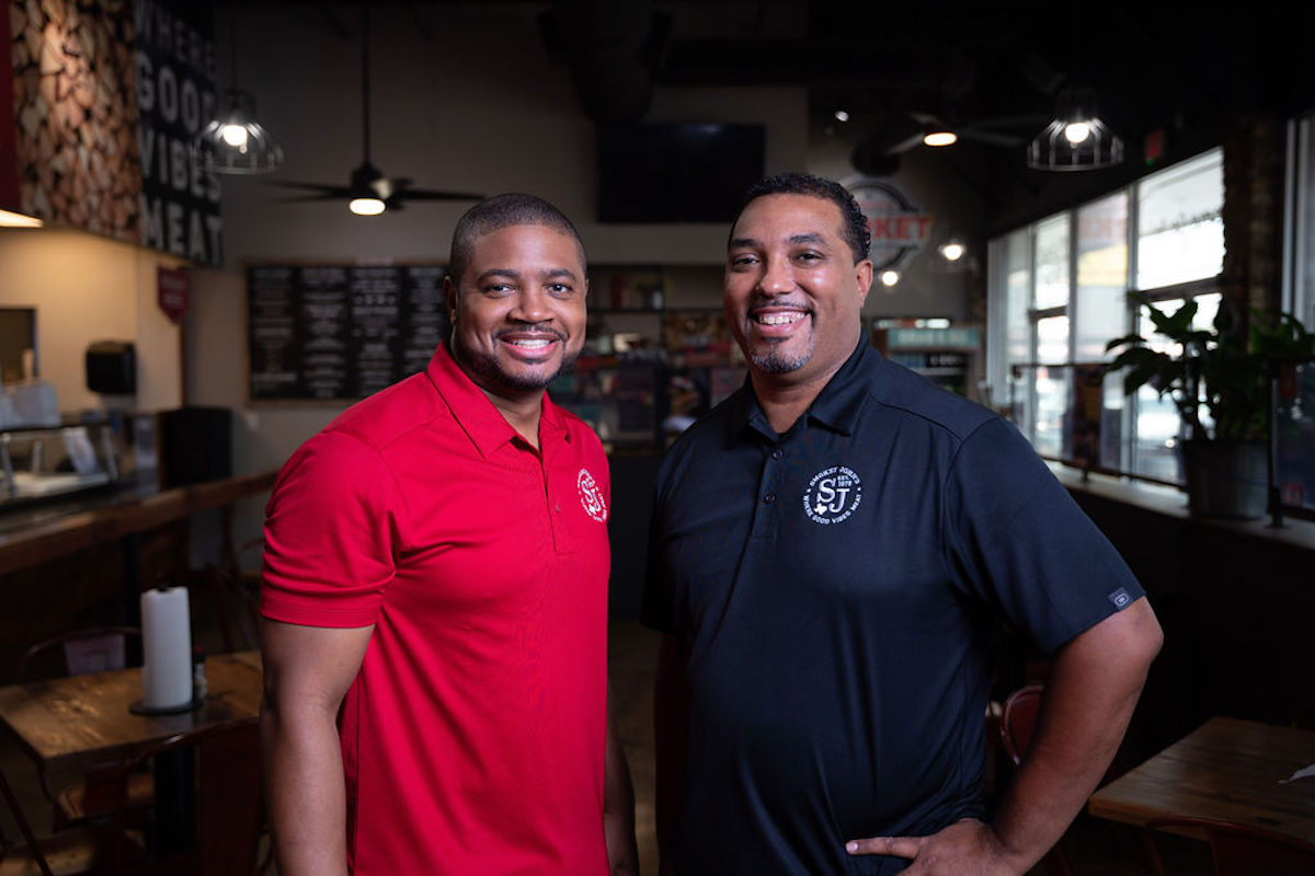 Brothers Juan and Brent Reaves carry on the legacy of their father, “Smokey” John Reaves, at the family-run Smokey John’s Bar-B-Que and Home Cooking in Dallas. | Photo by Smokey John's BBQ