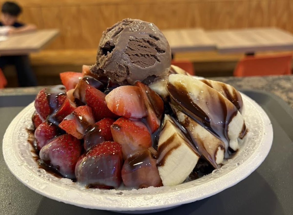 Juicy Box - DiningOut Juicy Box takes shaved ice over the top with fresh strawberries and bananas, chocolate drizzle, and a generous scoop of chocolate ice cream. | Photo by Juicy Box