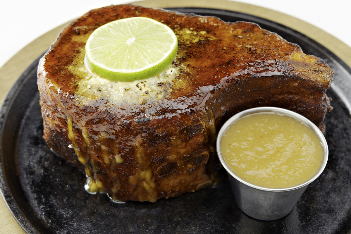 Perry's Steakhouse - DiningOut Perry’s Famous Pork Chop takes center stage on National Pork Chop Day, when Perry’s Steakhouse & Grille offers a four-course dinner for on August 27. | Photo by Perry's Steakhouse