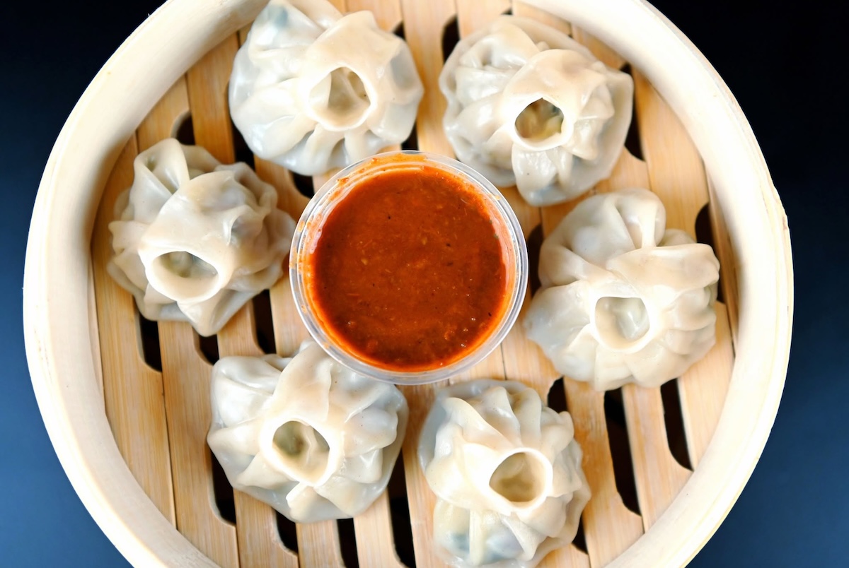 NYC_Fomo Momo_dumplings - DiningOut Indian dumplings await. | Photo courtesy of Fomo Momo