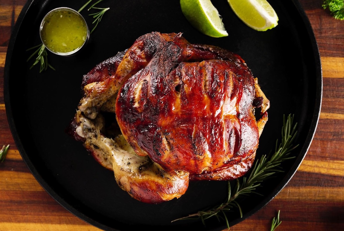 NYC_Malecon_chicken roasted - DiningOut Head to Washington Heights for a flavorful rotisserie chicken and more. | Photo courtesy of Malecon