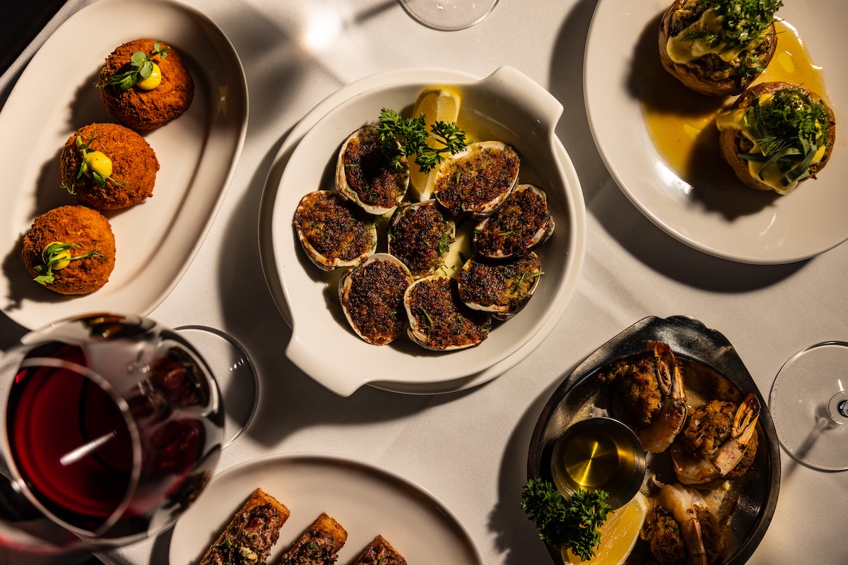 NYC_The_Derby_Bar_by_Dillon Burke_Hors DOeuvres Spread_ Clams Casino Baked Stuffed Shrimp Top Hat Croquettes - DiningOut Clams Casino, baked and stuffed shrimp, and Top Hat Croquettes are appetizers at The Derby Bar. | Photo by Dillion Burke
