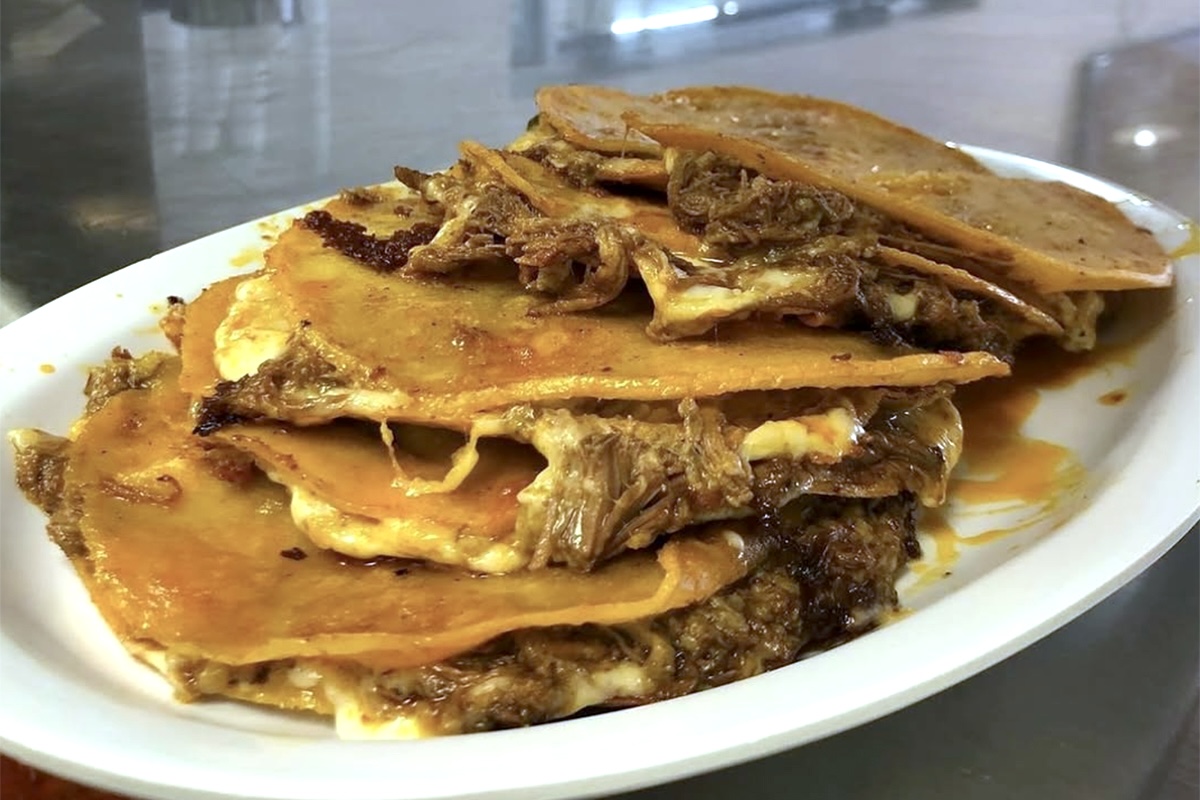 PHX Birrieria Obregon - DiningOut The quesabirria tacos at Birrieria Obregon are still made the traditional way with goat meat. | Photo by Birrieria Obregon