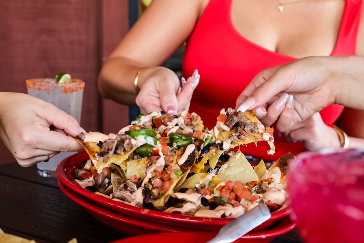 Definitely grab an order of nachos. | Photo courtesy of Cien Agaves Tacos & Tequila