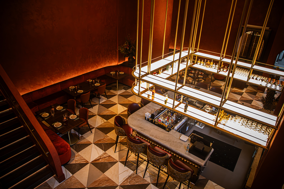 The dramatic dining room and bar at Pataaka, chef Anish Nair’s new regional Indian restaurant at Spring Quarter in Midtown. | Photo by Spark Novus