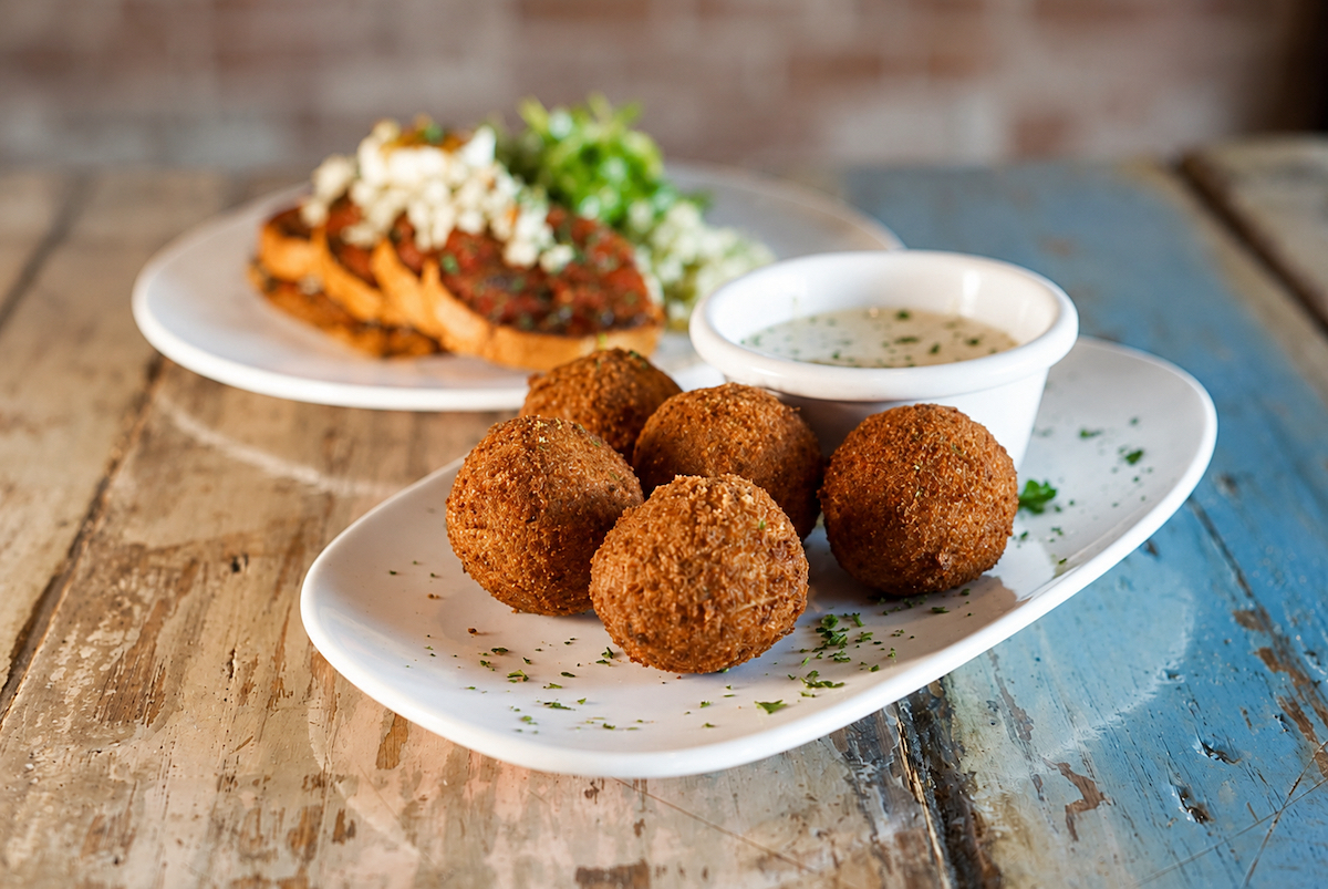 Pickleballs - Cream cheese and Dill Pickle Fritters with Yogurt Ranch_Joel Ramirez - DiningOut The cheekily named Pickleballs are cream cheese and dill pickle fritters served with yogurt ranch.| Photo by Joel Ramirez.