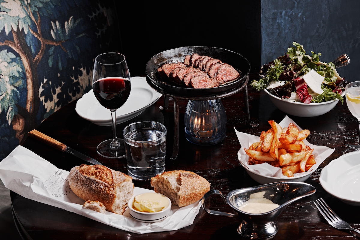 At Bar Blanc, steak frites is the main event, served prix fixe with prime ribeye and unlimited fries. | Photo by Andrew Thomas Lee