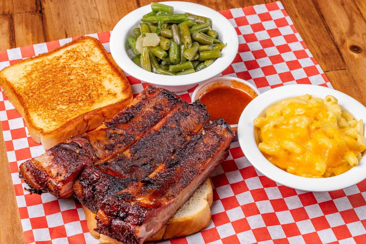 Smokey Johns BBQ DAL - DiningOut Smokey John’s serves its hickory-smoked ribs with classic comfort-food sides, including mac and cheese, green beans and Texas toast. | Photo by Smokey John's BBQ