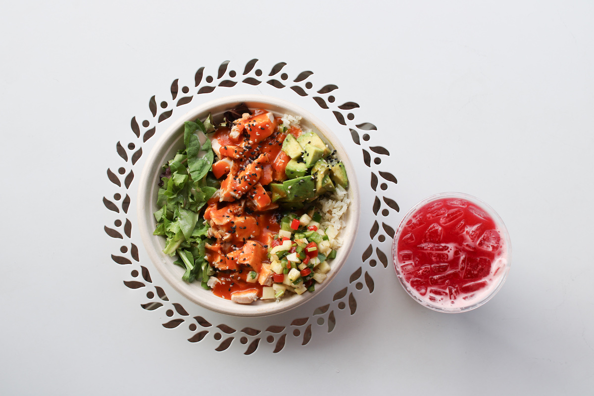 Original ChopShop’s new Spicy Hawaiian Chicken Bowl combines jasmine rice, greens, piña pico, avocado, sesame seeds, and spicy Hawaiian sauce. | Photo by Original ChopShop