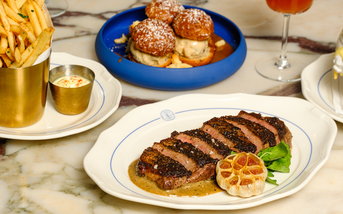 Steak frites gets the modern French bistro treatment at Chardon, where steak is served with pommes frites and a rich au poivre sauce. | Photo by Quit Nguyen