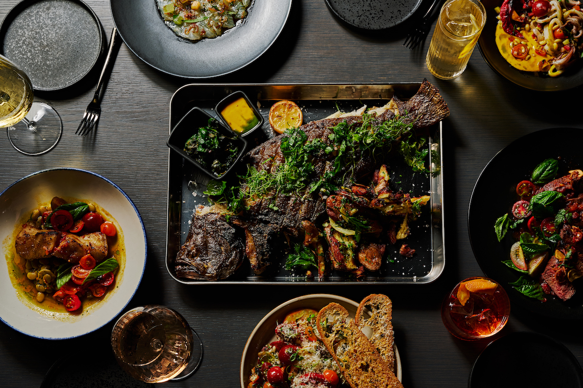 Whole wood-roasted flounder anchors Siren’s seafood-focused menu, alongside crudo, raw-bar selections, and dishes inspired by coastlines around the world. | Photo by Andrew Thomas Lee