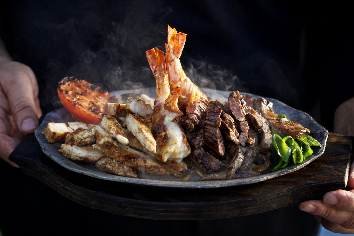 The Parrillada Familiar at Goode Co. Kitchen & Cantina is a feast of fajitas, shrimp, chicken, and other grilled favorites made for sharing. | Photo by Goode Co.