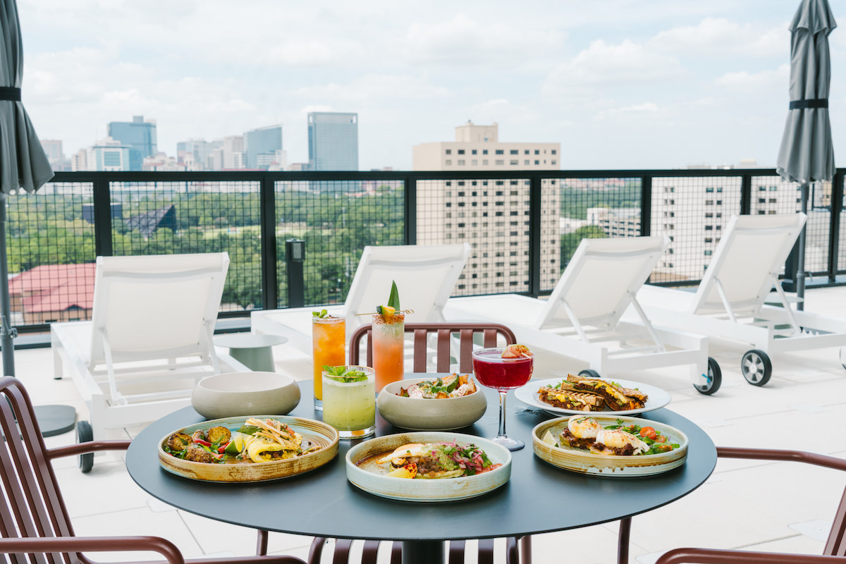 Food and cocktails are served poolside at The Branch, where 12th-floor views stretch from Houston’s Museum District toward Downtown. | Photo by Rebekah Flores