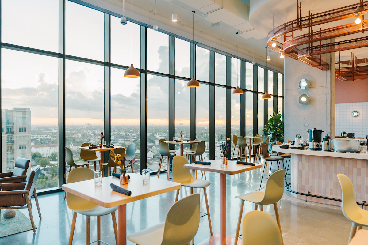 Floor-to-ceiling windows frame sweeping Houston views from The Branch, the new 12th-floor restaurant and lounge inside Forme in the Museum District. | Photo by Rebekah Flores.