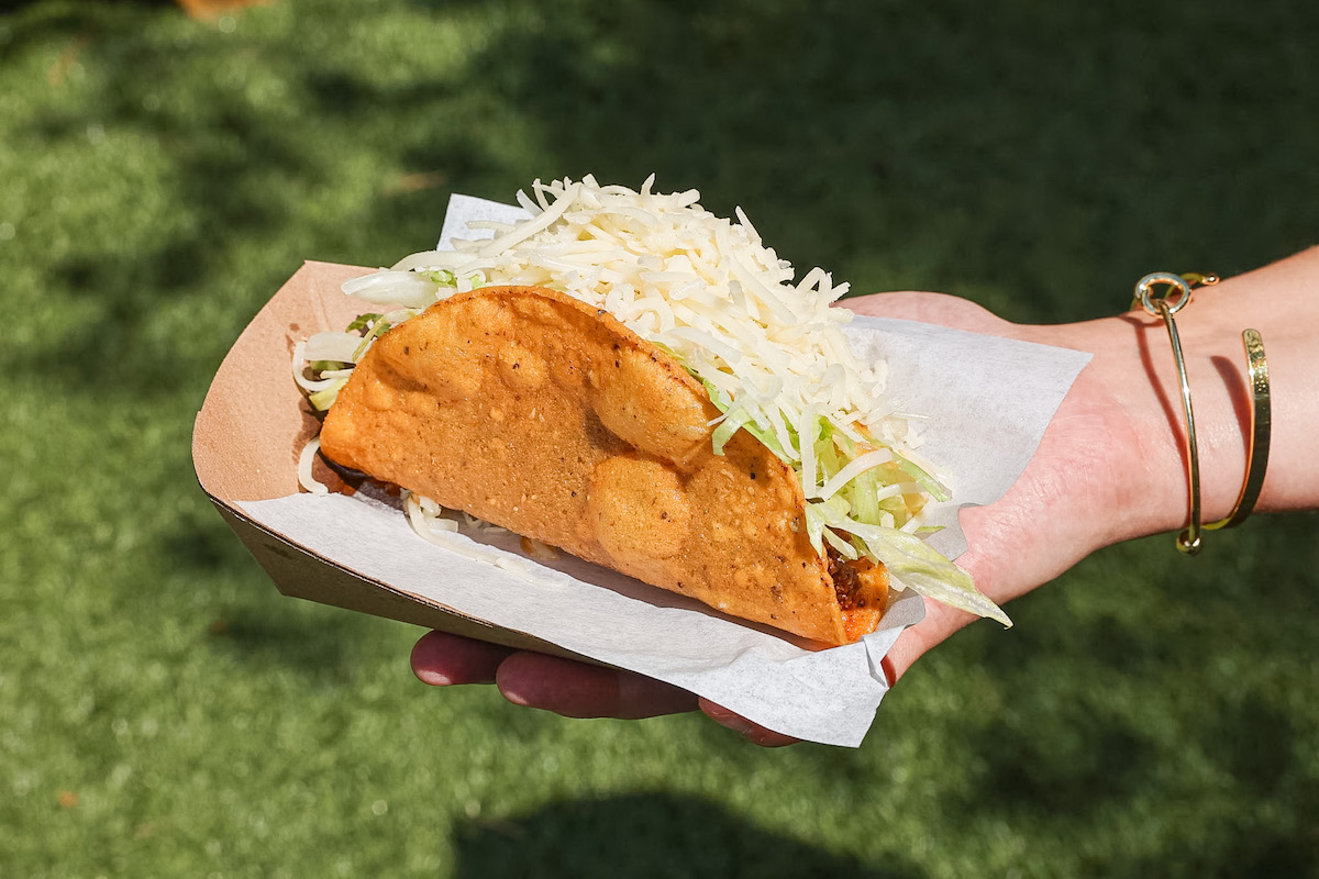 Little Rey’s new crispy beef taco is filled with beef picadillo, shredded lettuce, Monterey Jack, cilantro, and salsa ranchero. | Photo by Little Rey