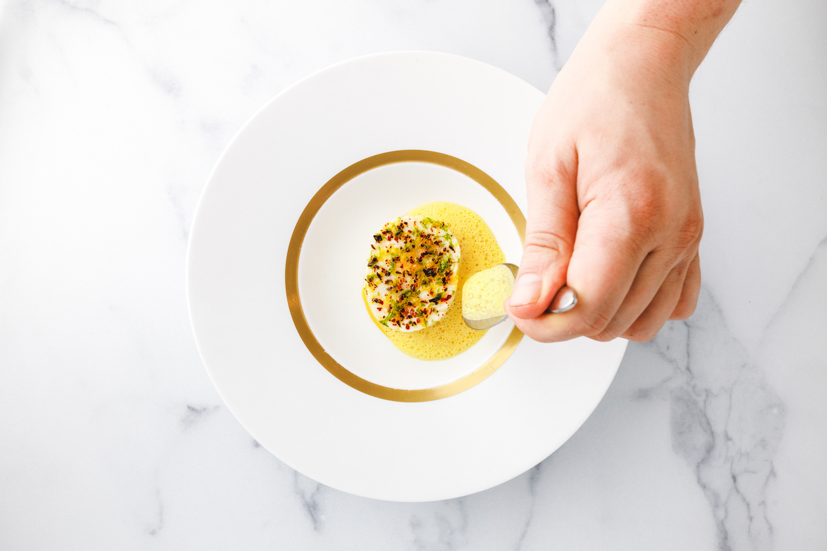 Cod with saffron-citrus sauce, the Atlas dish featured as an excerpted recipe from chef Freddy Money’s new cookbook. | Photo by Tomas Espinoza