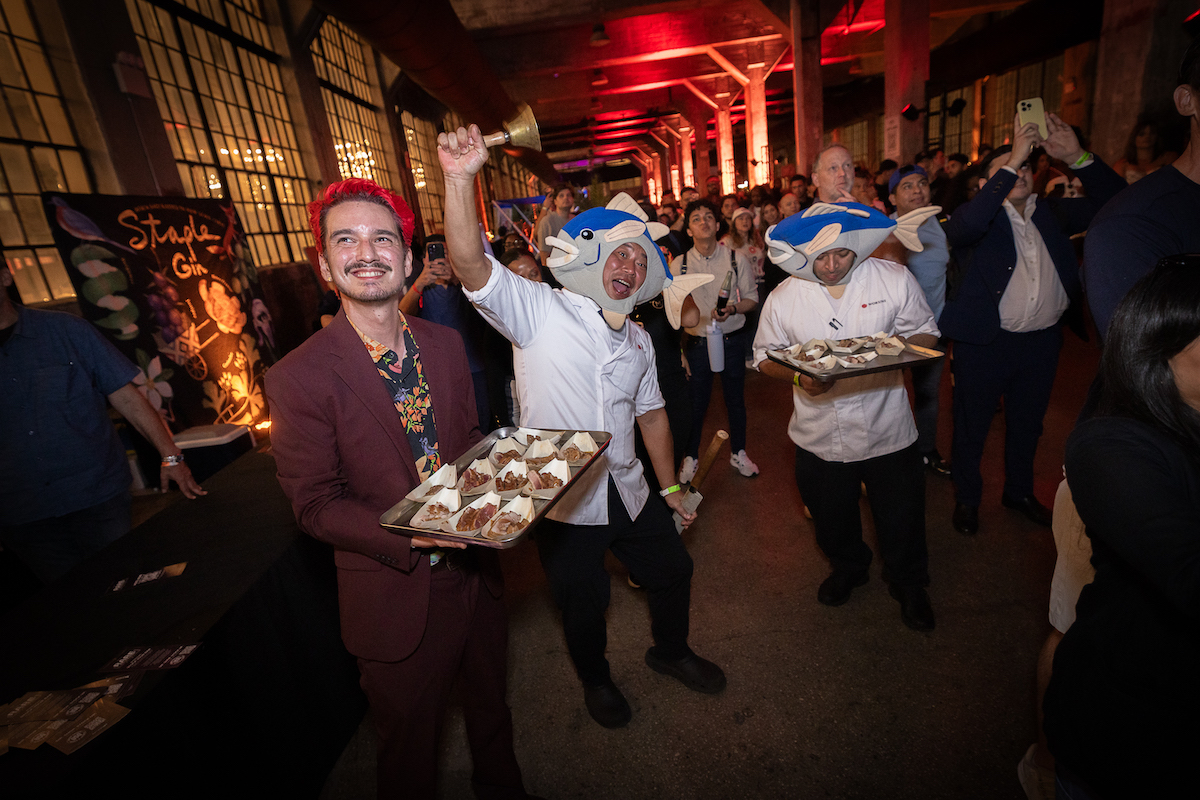 RARE NYC - DiningOut Wukoni chefs bring the energy—and plenty of seafood—to the VIP crowd during RARE Steak Championship New York at Industry City. | Photo by Guy Piaquadio