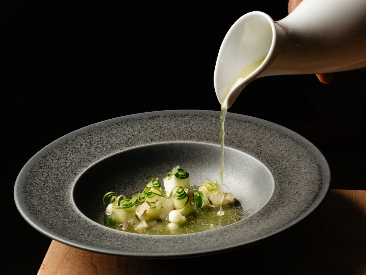 Carmen’s Cucumbers, inspired by chef Demetrius Brown’s childhood memories of eating cucumbers from his aunt’s garden, features cucumbers prepared several ways with uziza seeds and mint. | Photo by Lauren Lynn Foto