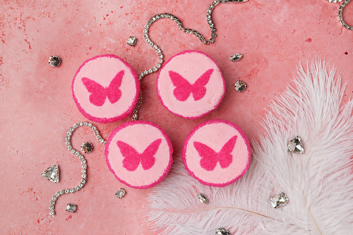 SusieCakes’ limited-time Dolly’s Decorated Cupcakes feature pink vanilla buttercream and butterfly toppers, with $1 from every cupcake sold benefiting Dolly Parton’s Imagination Library. | Photo by SusieCakes
