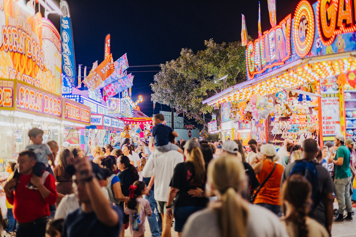 Grapefest DAL - DiningOut As the sun goes down, GrapeFest keeps the party going with a brightly lit midway packed with carnival games, festival food, and family-friendly fun. | Photo by Grapevine CVB