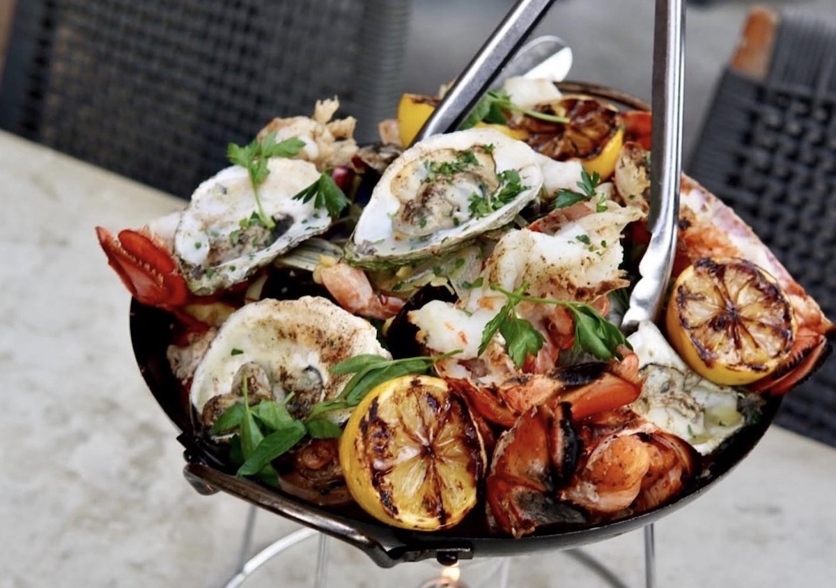 Little Alley Steak ATL - DiningOut Oysters, lobster, and other shellfish pile high on a seafood tower at Little Alley Steak. | Photo by Little Alley Steak