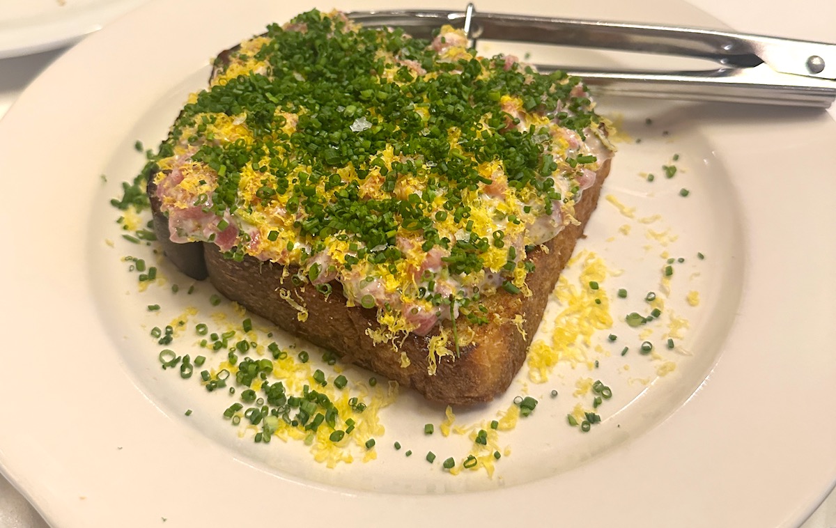 Carrie Baird’s signature Fancy Toast layers Centennial beef tartare, caper aioli, cured egg yolk and chives over housemade sourdough, with toppings set to change with the seasons. | Photo by Megha McSwain
