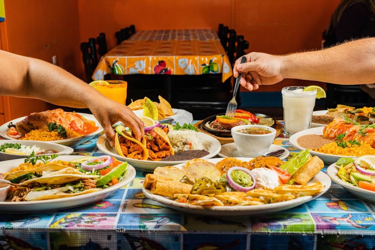 A table packed with Tex-Mex favorites at Mia’s, the longtime Lemmon Avenue restaurant that landed third in the reader poll with 19 recommendations. | Photo by Mia's