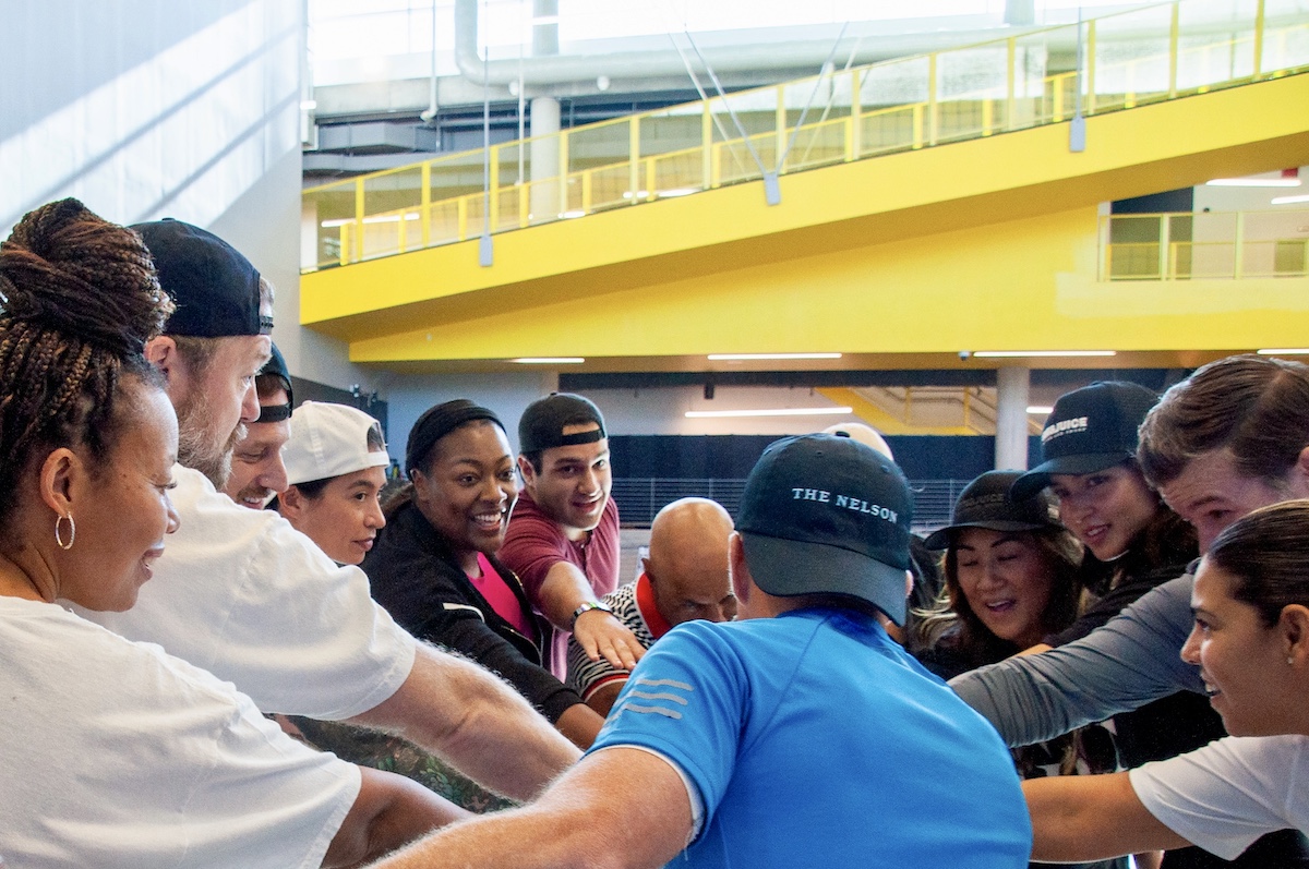 Shef Food + Wine Festival: Chefs and guests huddle up during a pickleball event at Tiffany Derry’s Shef Food + Wine Festival in Grand Prairie. | Photo by Shef Food + Wine Festival
