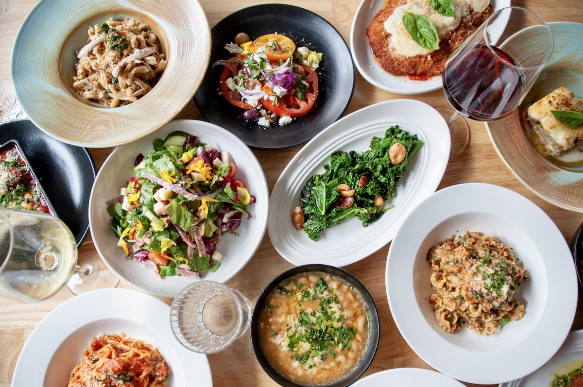 A colorful spread of pastas, salads, vegetables, and other Italian-inspired dishes at Tiffany Derry’s Radici Wood Fire Grill. | Photo by Radici Wood Fire Grill