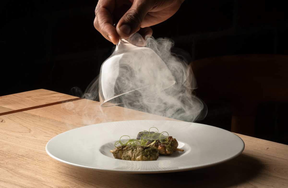 Heritage’s take on shepherd’s pie arrives tableside beneath a veil of smoke, adding a bit of theater to chef Demetrius Brown’s tasting menu. | Photo by Lauren Lynn Foto