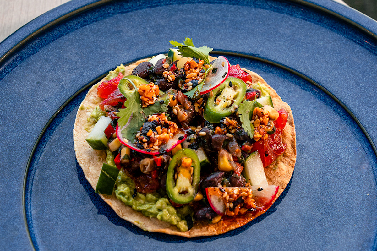 The tuna tostada at The Branch layers yellowfin tuna with black bean caviar, crushed avocado and mole chile crunch on an oven-baked tostada. | Photo by Atrium Agency