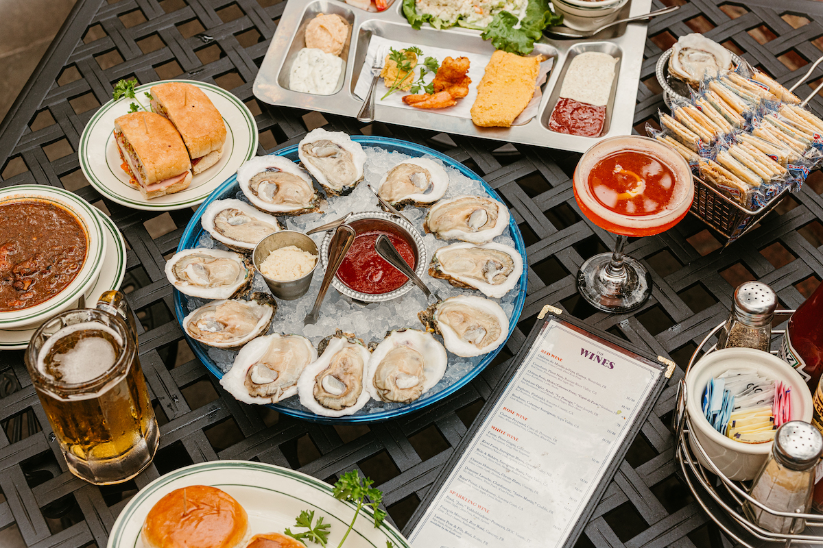 A spread of oysters, seafood, sandwiches, and drinks at S&D Oyster Company, which celebrates 50 years in Uptown Dallas this week. | Photo by S&D Oyster Company